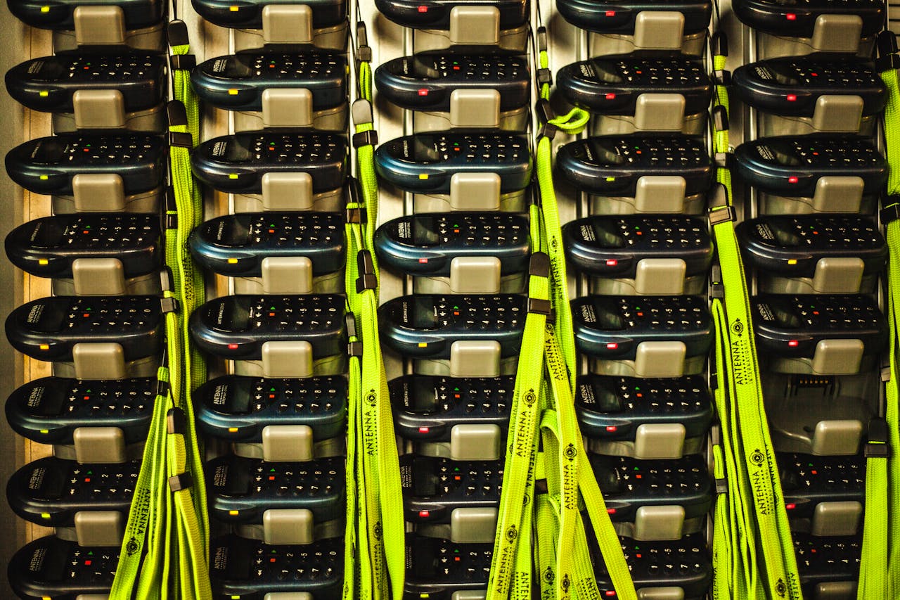 Electronic devices neatly organized in storage with charging cables for efficient management.